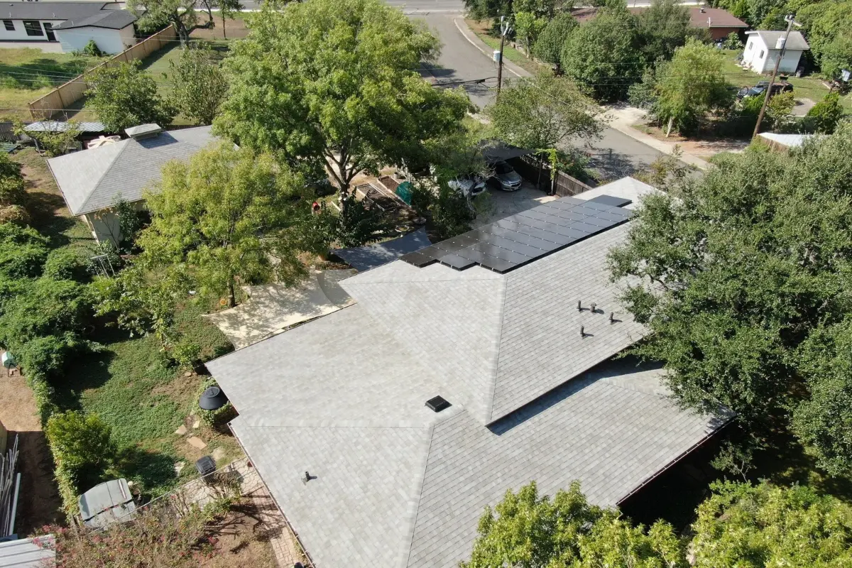 Completed ThermalGuard roof with Atlas Pinnacle Sun shingles on a house and shop in San Antonio